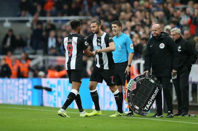 NEWCASTLE UPON TYNE, ENGLAND - OCTOBER 06: Joelinton of Newcastle United comes off for Andy Carroll of Newcastle United during the Premier League match between Newcastle United and Manchester United at St. James Park on October 06, 2019 in Newcastle upon Tyne, United Kingdom. (Photo by Jan Kruger/Getty Images)