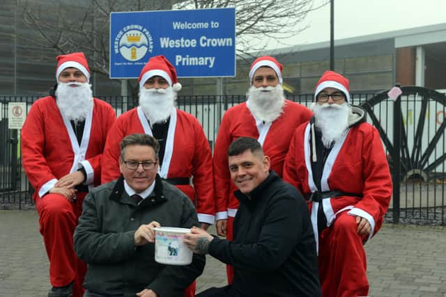 Santa's Liam Fada, Danny Fada, John Fada and Scott West with Jak's dad Tony Fada and Westoe Crown Primary School headteacher Steve Price.