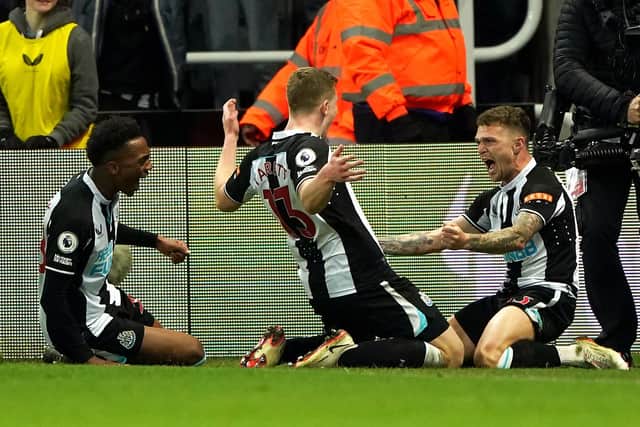 Newcastle United's Kieran Trippier, right, celebrates his goal with Matt Targett and Joe Willock.