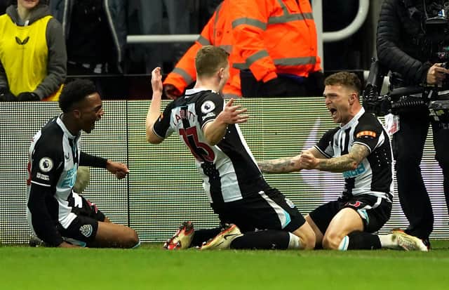 Newcastle United's Kieran Trippier, right, celebrates his goal with Matt Targett and Joe Willock.
