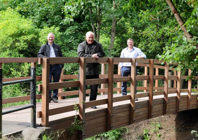 South Tyneside Council Cllr Ernest Gibson with ESH Civil's Steve Marshall and Stephen McClean on the newly installed bridge over the River Don at Mill Dene, Primrose, Jarrow.