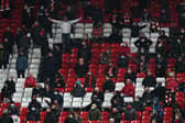 Fans react during the Premier League match between Liverpool and Tottenham Hotspur at Anfield in December. (Photo by Jon Super - Pool/Getty Images)