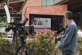 A large television screen near Manchester Crown Court broadcasts the judge sentencing convicted hospital nurse Lucy Letby. Photo by Christopher Furlong/Getty Images