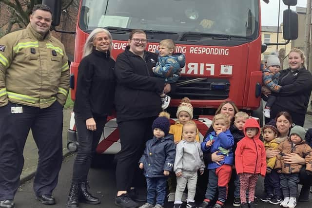 Youngsters and staff at Nurserytime meet the fire crew.
