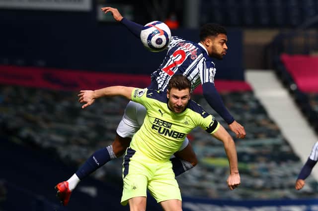 West Bromwich Albion's English defender Darnell Furlong (up) vies with Newcastle United's Welsh defender Paul Dummett during the English Premier League football match between West Bromwich Albion and Newcastle United at The Hawthorns stadium in West Bromwich, central England, on March 7, 2021.
