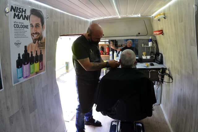 Ali Barber owner Ali Sezer with his new mobile barber van.