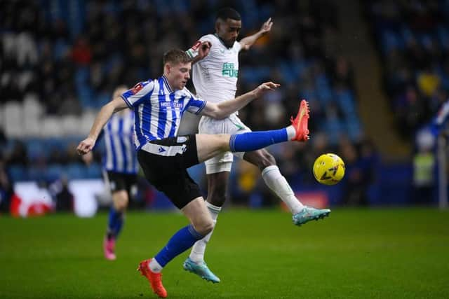 Mark McGuinness of Sheffield Wednesday battles for possession with Alexander Isak of Newcastle United during the Emirates FA Cup Third Round match between Sheffield Wednesday and Newcastle United at Hillsborough on January 07, 2023 in Sheffield, England. (Photo by Laurence Griffiths/Getty Images)