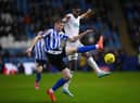 Mark McGuinness of Sheffield Wednesday battles for possession with Alexander Isak of Newcastle United during the Emirates FA Cup Third Round match between Sheffield Wednesday and Newcastle United at Hillsborough on January 07, 2023 in Sheffield, England. (Photo by Laurence Griffiths/Getty Images)