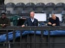 Former players and television presenters Micah Richards, Alan Shearer and Gary Lineker watch the match during the English FA Cup quarter-final football match between Newcastle United and Manchester City at St James' Park