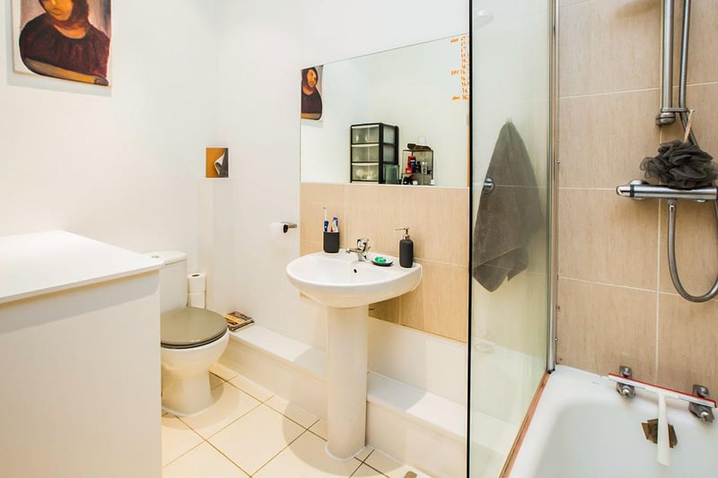 A modern and stylish bathroom area which is fitted with a three-piece suite