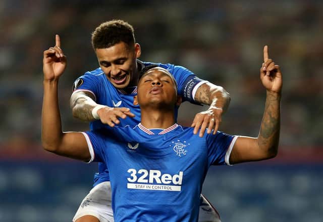 Alfredo Morelos of Rangers celebrates with team-mate James Tavernier, the former Newcastle United defender.