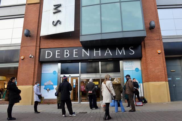 Shoppers wait to get into Sunderland's Debenhams store, which will close on Saturday, May 8.