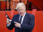 Prime Minister Boris Johnson, pictured holding his face mask,  before boarding the vessel Alba at Fraserburgh Harbour, Aberdeenshire in August. Picture: Jane Barlow/POOL/AFP via Getty Images.
