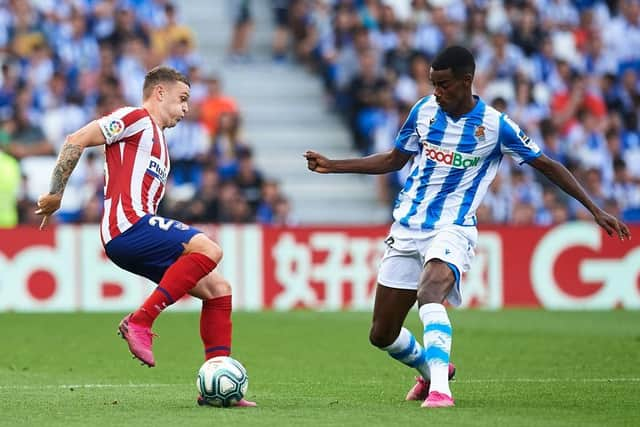 Kieran Trippier of Atletico de Madrid (L) being followed by Alexander Isak of Real Sociedad  (R) during the Liga match between Real Sociedad and Club Atletico de Madrid at Estadio Reale Arena on September 14, 2019 in San Sebastian, Spain. (Photo by Juan Manuel Serrano Arce/Getty Images)