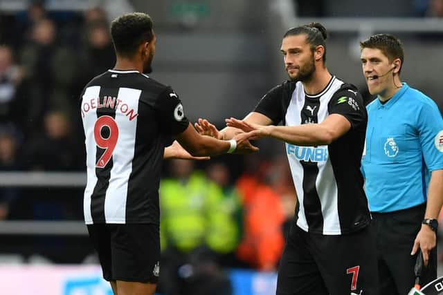 Newcastle United's English striker Andy Carroll (C) comes on as a substitute for Newcastle United's Brazilian striker Joelinton (L)  during the English Premier League football match between Newcastle United and Manchester United at St James's Park in Newcastle-upon-Tyne, north east England on October 6, 2019.