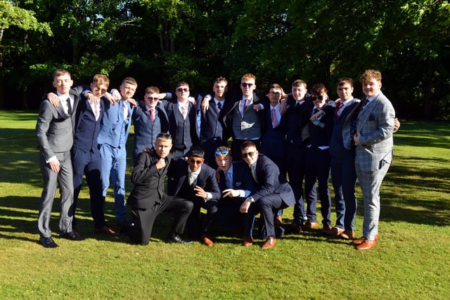 Year 11 boys pose for the camera ahead of their last night together as a year group.