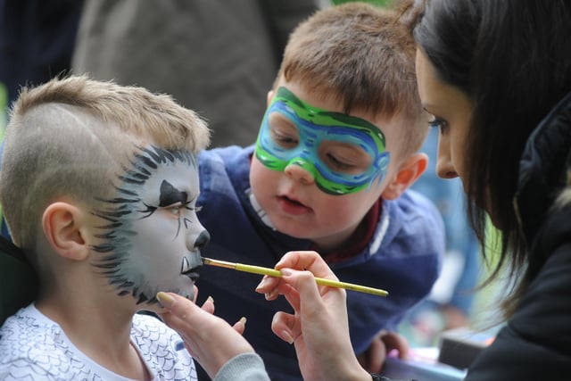 Traymane Treanor is watched by his cousin Samuel Davies as he has his face painted at Jarrow Festival's Medieval Fayre in 2016.