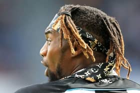 Newcastle United's French midfielder Allan Saint-Maximin gestures during the English Premier League football match between Newcastle United and Leicester City at St James' Park in Newcastle-upon-Tyne, north east England on April 17, 2022. (Photo by LINDSEY PARNABY/AFP via Getty Images)