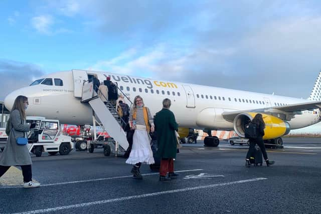 Passengers board the first flight