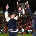 Hollywood stars Rob McElhenney and Ryan Reynolds, the owners of Wrexham celebrate with the Vanarama National League trophy in Apairl. MK Dons will start the new sky Bert League Two season at the Racecourse Ground (Picture: Jan Kruger/Getty Images)