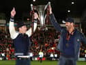 Hollywood stars Rob McElhenney and Ryan Reynolds, the owners of Wrexham celebrate with the Vanarama National League trophy in Apairl. MK Dons will start the new sky Bert League Two season at the Racecourse Ground (Picture: Jan Kruger/Getty Images)