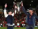 Hollywood stars Rob McElhenney and Ryan Reynolds, the owners of Wrexham celebrate with the Vanarama National League trophy in Apairl. MK Dons will start the new sky Bert League Two season at the Racecourse Ground (Picture: Jan Kruger/Getty Images)