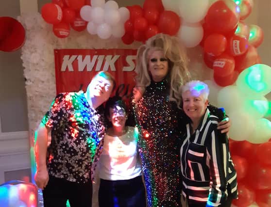 Drag star Miss Vicky Paris with former Kwik Save staff at the reunion in South Shields.