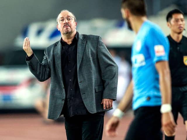 Dalian Yifang's new head coach Rafael Benitez (L) gestures during the Chinese Super League (CSL) football match between Dalian Yifang and Henan Jianye in Dalian in northeast China's Liaoning province on July 7, 2019. (Photo by STR / AFP) / China OUT        (Photo credit should read STR/AFP via Getty Images)