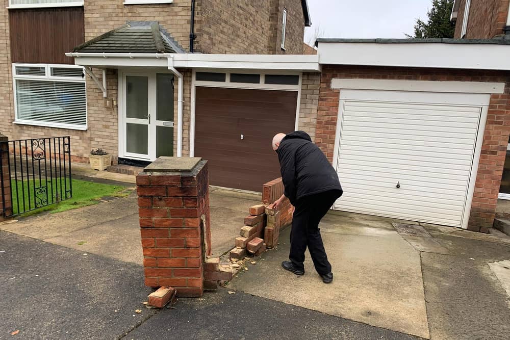 Donald Wood with his damaged wall