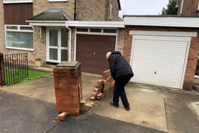 Donald Wood with his damaged wall