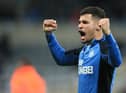 Newcastle United's Brazilian midfielder Bruno Guimaraes reacts to their win on the pitch after the English Premier League football match between Newcastle United and Wolverhampton Wanderers at St James' Park in Newcastle-upon-Tyne, north east England on April 8, 2022.  (Photo by LINDSEY PARNABY/AFP via Getty Images)