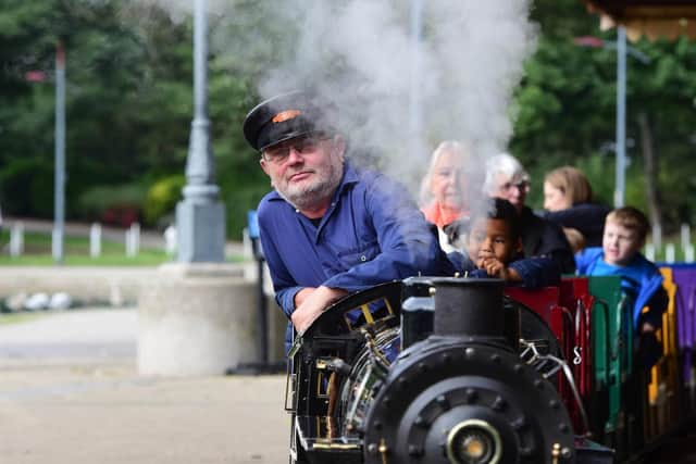 Keith Nye is ready for another journey on the miniature train.