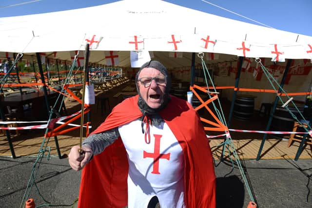 Dougie's Tavern manager Norman Scott celebrates St George's Day.