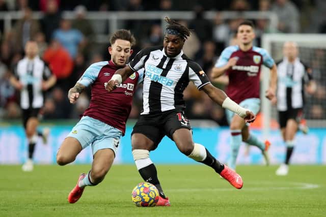 Allan Saint-Maximin of Newcastle United is tackled by Josh Brownhill of Burnley during the Premier League match between Newcastle United and Burnley at St. James Park on December 04, 2021 in Newcastle upon Tyne, England. (Photo by Ian MacNicol/Getty Images)