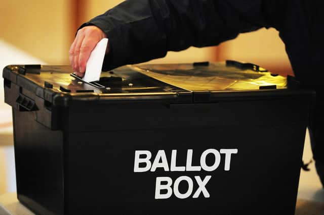 A voter placing a ballot paper in a ballot box. PIC: Rui Vieira/PA Wire