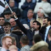 Yasir Al-Rumayyan, Chairman of Newcastle United waves a flag prior to the Premier League match between Newcastle United and Crystal Palace at St. James Park on April 20, 2022 in Newcastle upon Tyne, England. (Photo by Ian MacNicol/Getty Images)