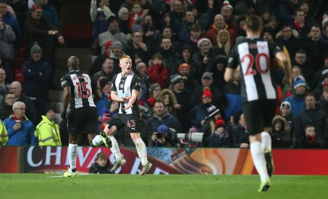 MANCHESTER, ENGLAND - DECEMBER 26: Matty Longstaff of Newcastle United celebrates scoring their first goal during the Premier League match between Manchester United and Newcastle United at Old Trafford on December 26, 2019 in Manchester, United Kingdom. (Photo by Tom Purslow/Manchester United via Getty Images)