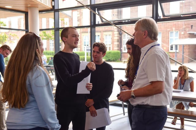 Harton Academy students talking to Sir Ken Gibson (right).