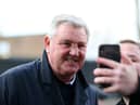 BURNLEY, ENGLAND - DECEMBER 14: Steve Bruce, Manager of Newcastle United poses for a selfie with a fan during the Premier League match between Burnley FC and Newcastle United at Turf Moor on December 14, 2019 in Burnley, United Kingdom.