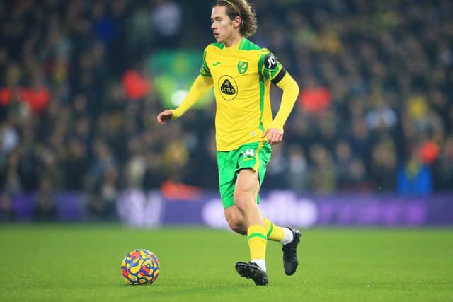 Todd Cantwell of Norwich City runs with the ball during the Premier League match between Norwich City and Aston Villa at Carrow Road on December 14, 2021 in Norwich, England. (Photo by Stephen Pond/Getty Images)