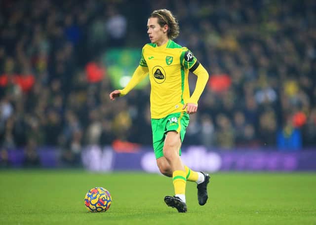 Todd Cantwell of Norwich City runs with the ball during the Premier League match between Norwich City and Aston Villa at Carrow Road on December 14, 2021 in Norwich, England. (Photo by Stephen Pond/Getty Images)