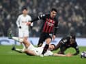 LONDON, ENGLAND - MARCH 08: Brahim Diaz of AC Milan runs with the ball after evading Ben Davies of Tottenham Hotspur during the UEFA Champions League round of 16 leg two match between Tottenham Hotspur and AC Milan at Tottenham Hotspur Stadium on March 08, 2023 in London, England. (Photo by Justin Setterfield/Getty Images)