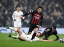 LONDON, ENGLAND - MARCH 08: Brahim Diaz of AC Milan runs with the ball after evading Ben Davies of Tottenham Hotspur during the UEFA Champions League round of 16 leg two match between Tottenham Hotspur and AC Milan at Tottenham Hotspur Stadium on March 08, 2023 in London, England. (Photo by Justin Setterfield/Getty Images)