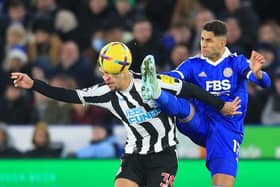 Newcastle United's Brazilian midfielder Bruno Guimaraes (L) vies with Leicester City's Spanish striker Ayoze Perez (R) during the English Premier League football match between Leicester City and Newcastle United at King Power Stadium in Leicester, central England on December 26, 2022 (Photo by LINDSEY PARNABY/AFP via Getty Images)