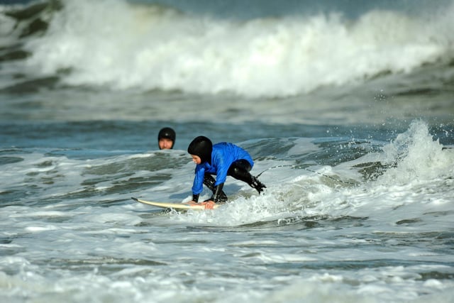 Young surfer competes the under 12's category of South Shields Surf School's Octuberfest