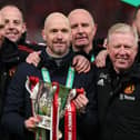 Erik ten Hag (C), Manager of Manchester United, Assistant Managers, Mitchell van der Gaag (L) and Steve McClaren celebrate with the Carabao Cup trophy following victory in the Carabao Cup Final match between Manchester United and Newcastle United at Wembley Stadium on February 26, 2023 in London, England. (Photo by Julian Finney/Getty Images)