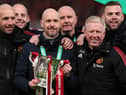 Erik ten Hag (C), Manager of Manchester United, Assistant Managers, Mitchell van der Gaag (L) and Steve McClaren celebrate with the Carabao Cup trophy following victory in the Carabao Cup Final match between Manchester United and Newcastle United at Wembley Stadium on February 26, 2023 in London, England. (Photo by Julian Finney/Getty Images)