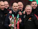 Erik ten Hag (C), Manager of Manchester United, Assistant Managers, Mitchell van der Gaag (L) and Steve McClaren celebrate with the Carabao Cup trophy following victory in the Carabao Cup Final match between Manchester United and Newcastle United at Wembley Stadium on February 26, 2023 in London, England. (Photo by Julian Finney/Getty Images)