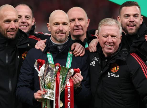 Erik ten Hag (C), Manager of Manchester United, Assistant Managers, Mitchell van der Gaag (L) and Steve McClaren celebrate with the Carabao Cup trophy following victory in the Carabao Cup Final match between Manchester United and Newcastle United at Wembley Stadium on February 26, 2023 in London, England. (Photo by Julian Finney/Getty Images)