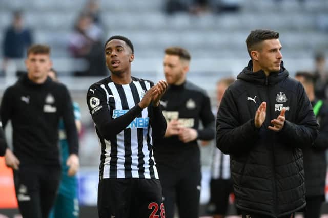 Joe Willock of Newcastle United applauds the fans after the Premier League match between Newcastle United and Sheffield United at St. James Park on May 19, 2021 in Newcastle upon Tyne, England.